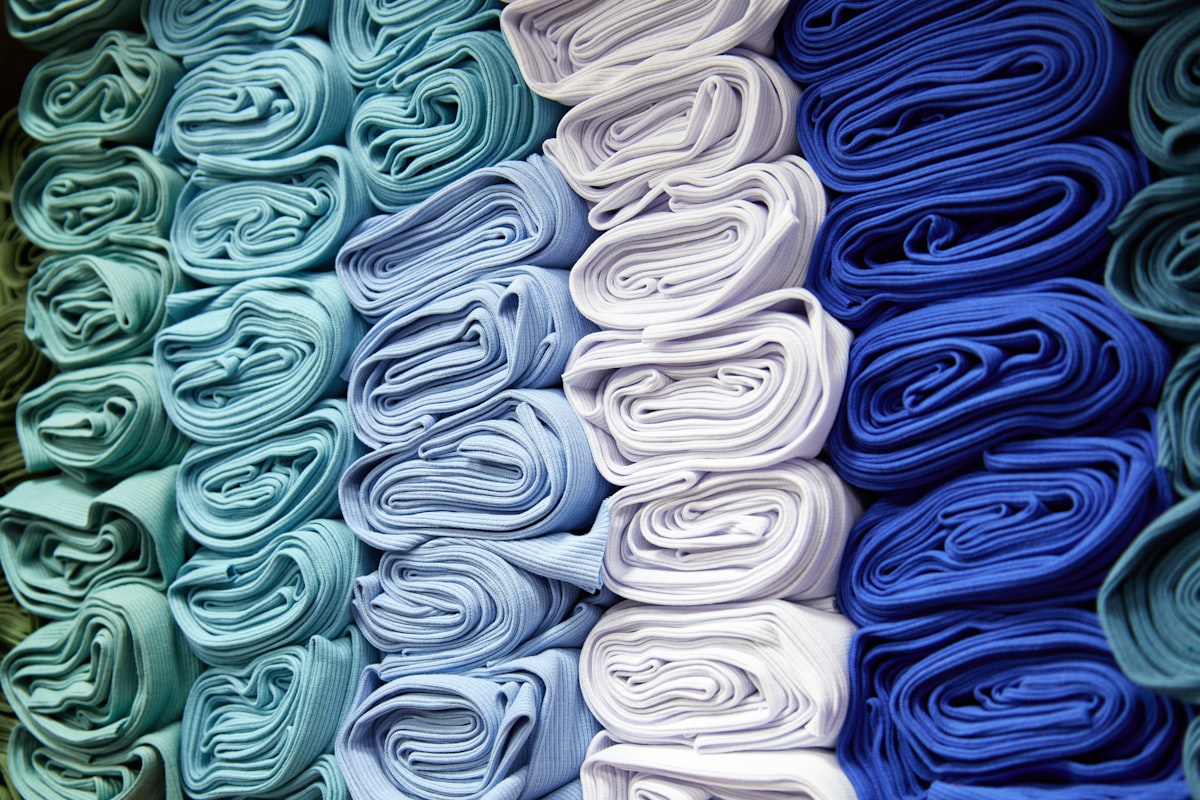 Rolls of fabric in shades of blue and white